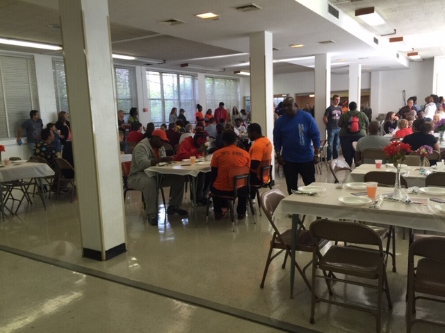 Community members gathered together at an indoor BKM 4 Life event