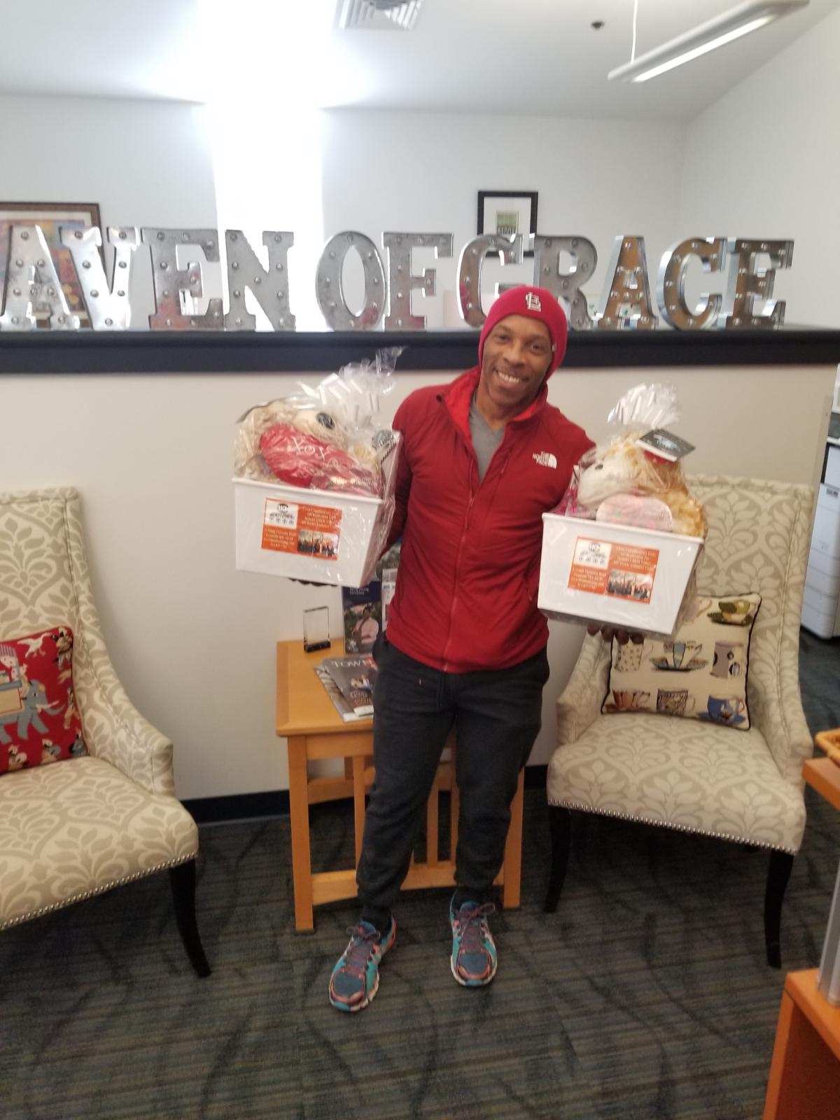 BKM 4 Life representative presenting donated gift baskets at Haven of Grace